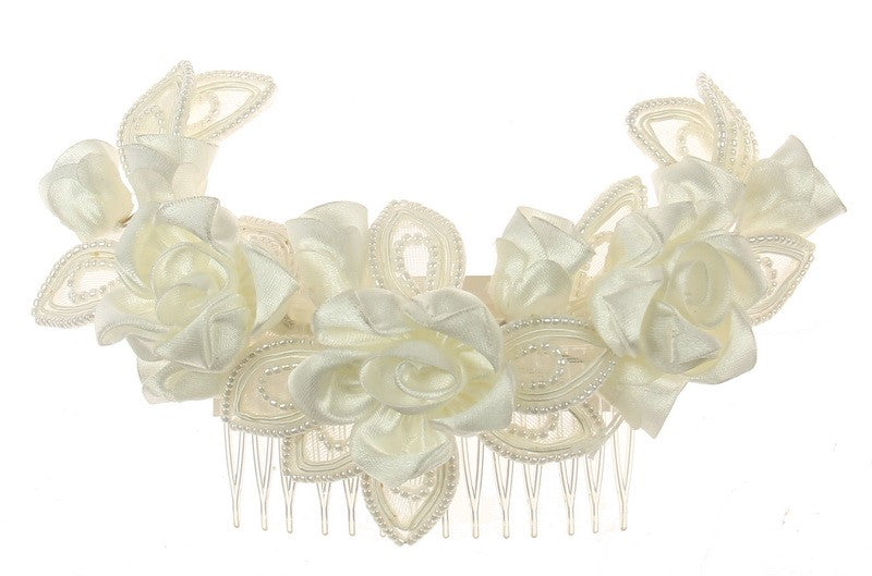 Elegant ivory bridal comb with intricate detailing, perfect for enhancing any wedding hairstyle on your special day.