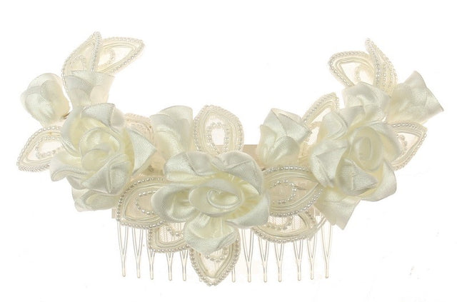 Elegant ivory bridal comb with intricate detailing, perfect for enhancing any wedding hairstyle on your special day.
