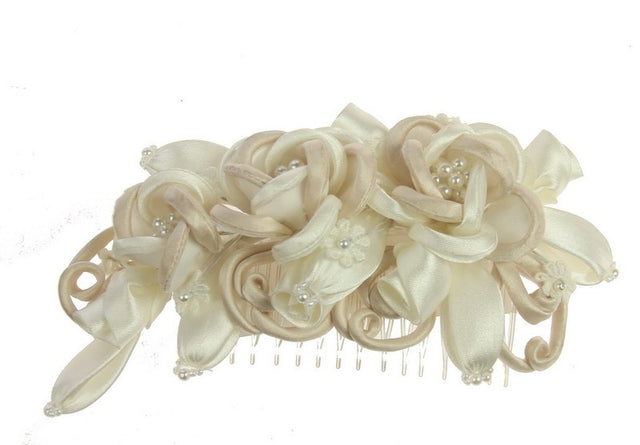 Elegant ivory bridal headpiece with champagne comb, enhancing modern wedding styles with delicate details and comfort.