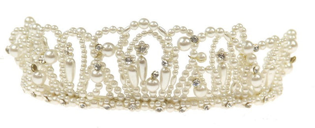Elegant white bridal headpiece adorned with lustrous pearls, perfect for enhancing any wedding hairstyle.