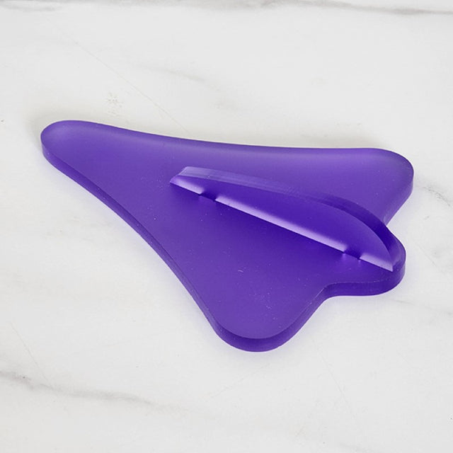 Purple satin acrylic jet plane wall art, inspired by Kiwi lollies, adds playful elegance to any room decor.