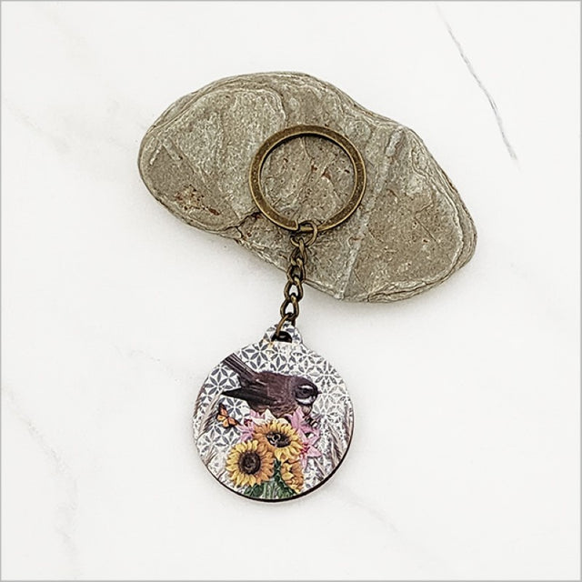 Floral Fantail keychain made of lightweight pine veneer, featuring vibrant Kiwiana floral design, perfect for everyday use.