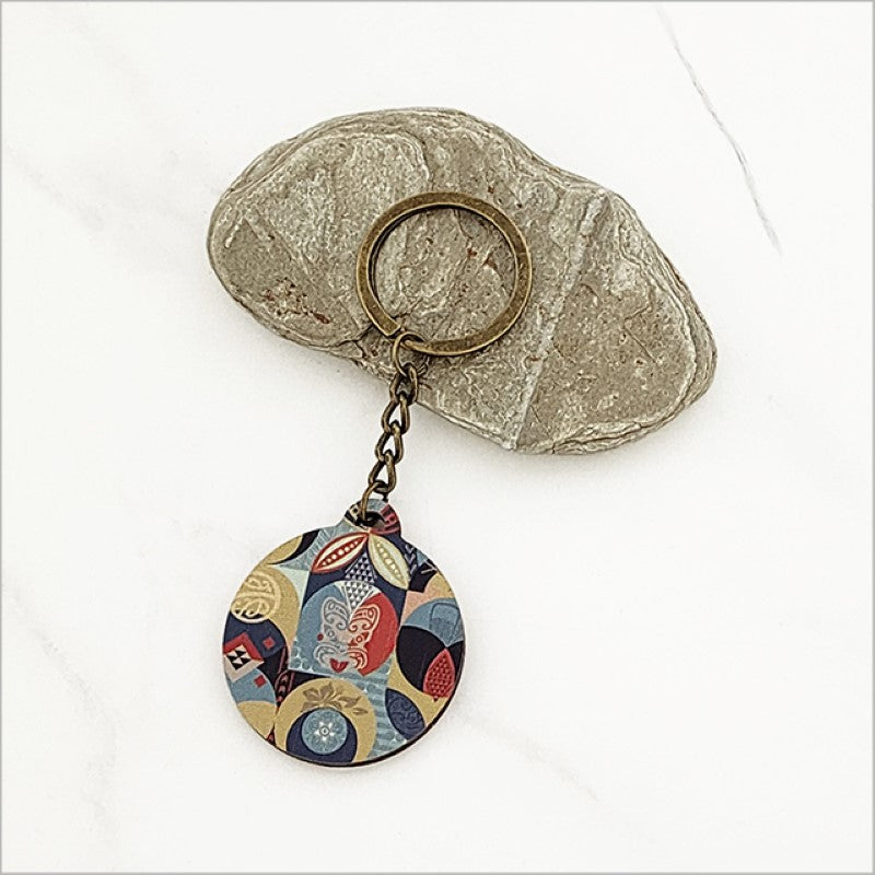 "Pacific Fusion 1 Printed Keychain in lightweight pine veneer, 40mm diameter, showcasing Kiwiana flair for stylish practicality."