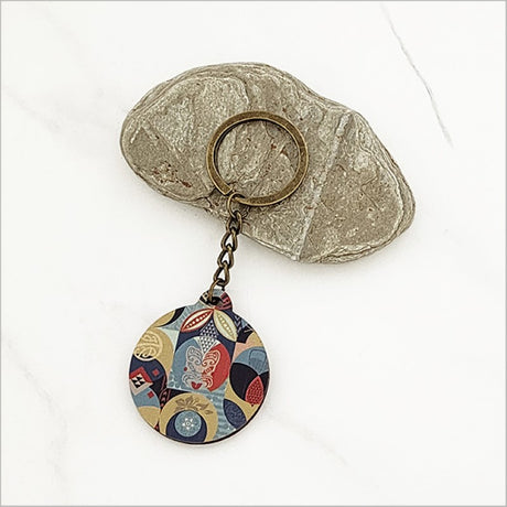 "Pacific Fusion 1 Printed Keychain in lightweight pine veneer, 40mm diameter, showcasing Kiwiana flair for stylish practicality."