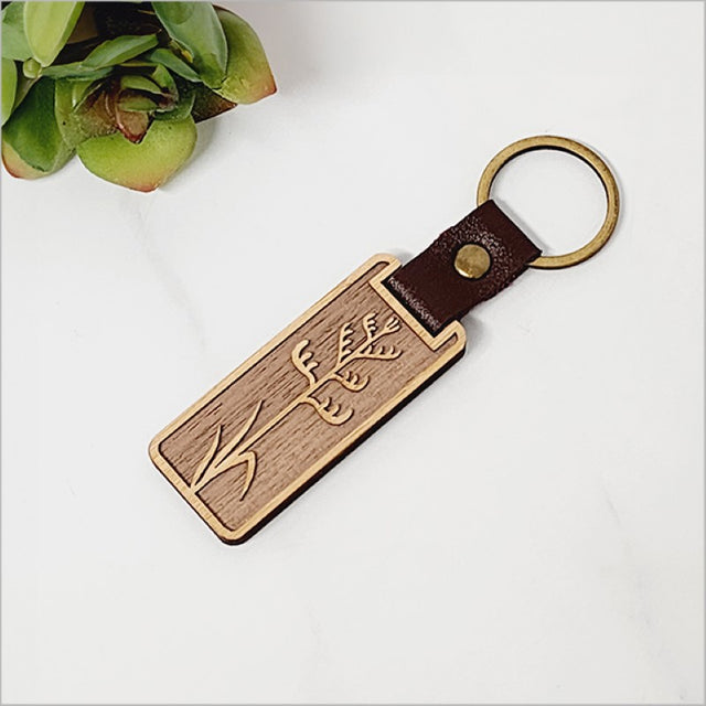 Bamboo keyring with Kiwiana flair, laser cut from durable veneer, lightweight, and perfect for travel or gifting.