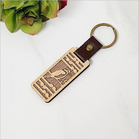 Bamboo keyring featuring a Kingfisher design and Koru pattern, perfect for adding Kiwiana charm to your keys.