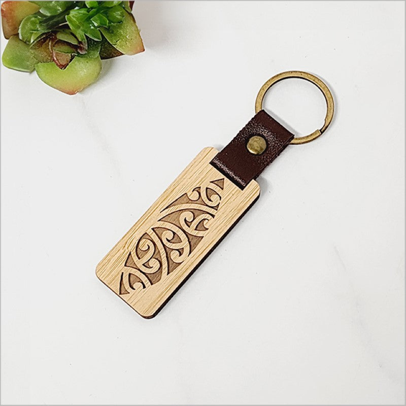 Lightweight bamboo keyring with Kiwiana charm, eco-friendly design, 110mm total length, perfect for stylish key organization.