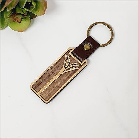 Laser-cut bamboo keyring showcasing Kiwiana charm, eco-friendly, lightweight, and perfect for stylish everyday use.