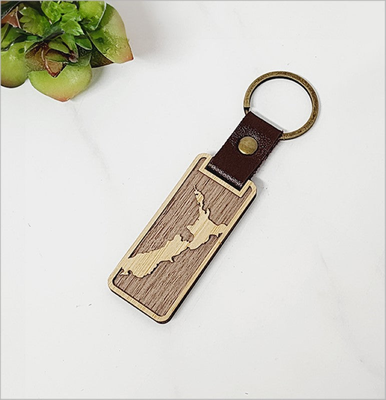 Eco-friendly bamboo keyring featuring a detailed NZ map, perfect for nature lovers and travelers.