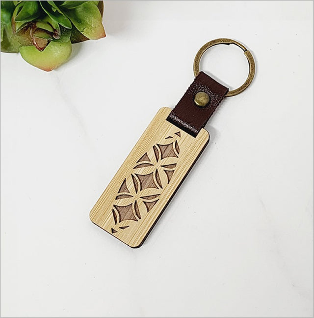 Eco-friendly bamboo keyring with Kiwiana charm, lightweight, stylish, and perfect for everyday use or gifting.