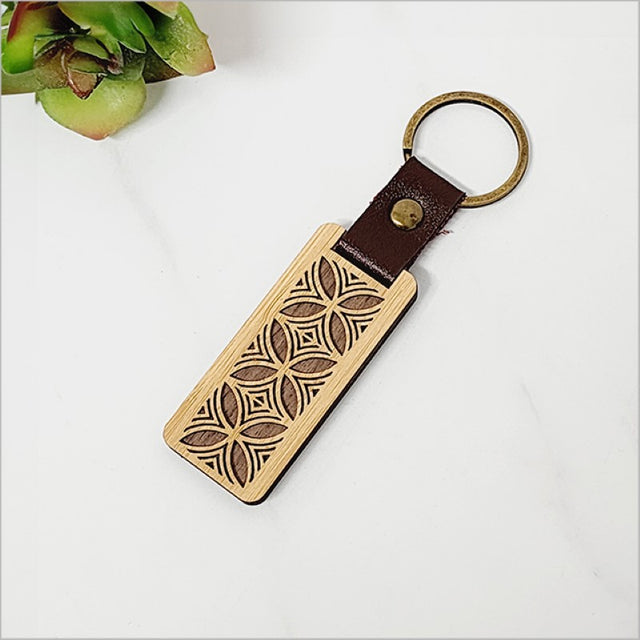 Bamboo Keyring - Tapa 2 featuring eco-friendly design, Kiwiana charm, and compact dimensions for stylish key accessories.