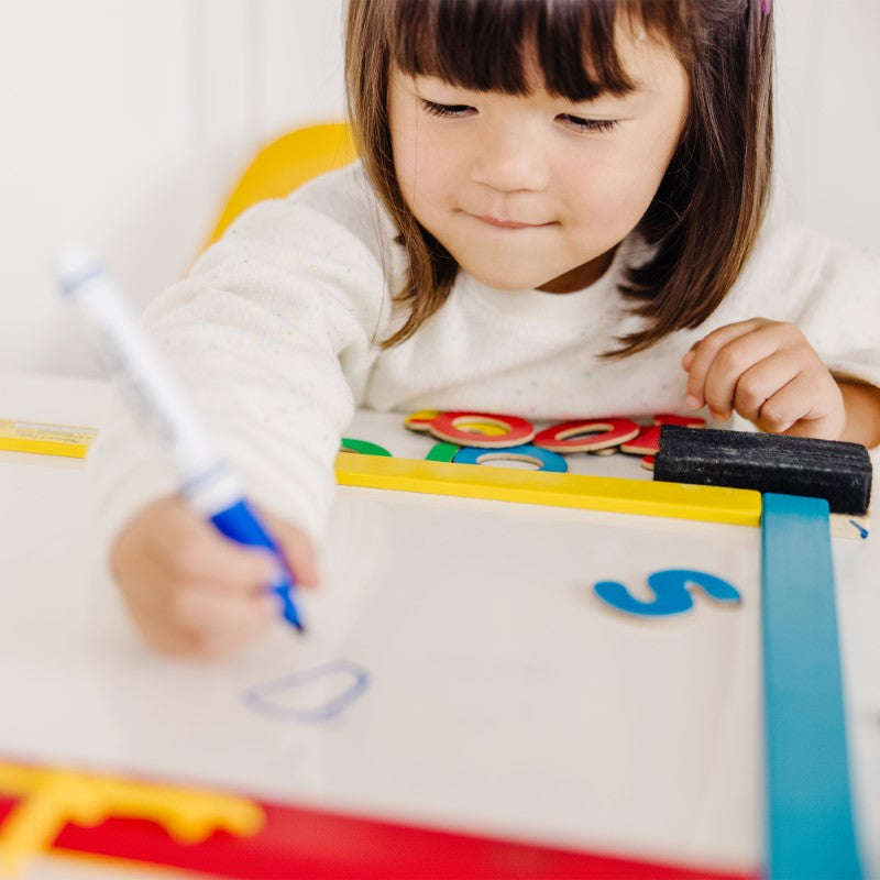 Dual-sided magnetic chalkboard and dry-erase board for kids, includes chalk, markers, letters, and numbers for creative learning.