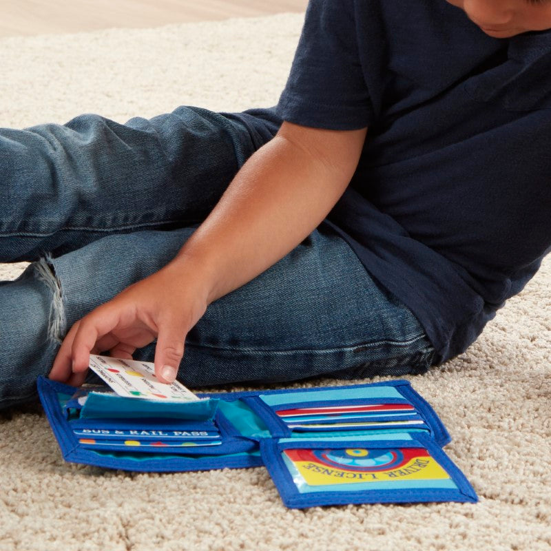 Colorful pretend wallet with play money, coins, and cards for imaginative shopping adventures and learning.