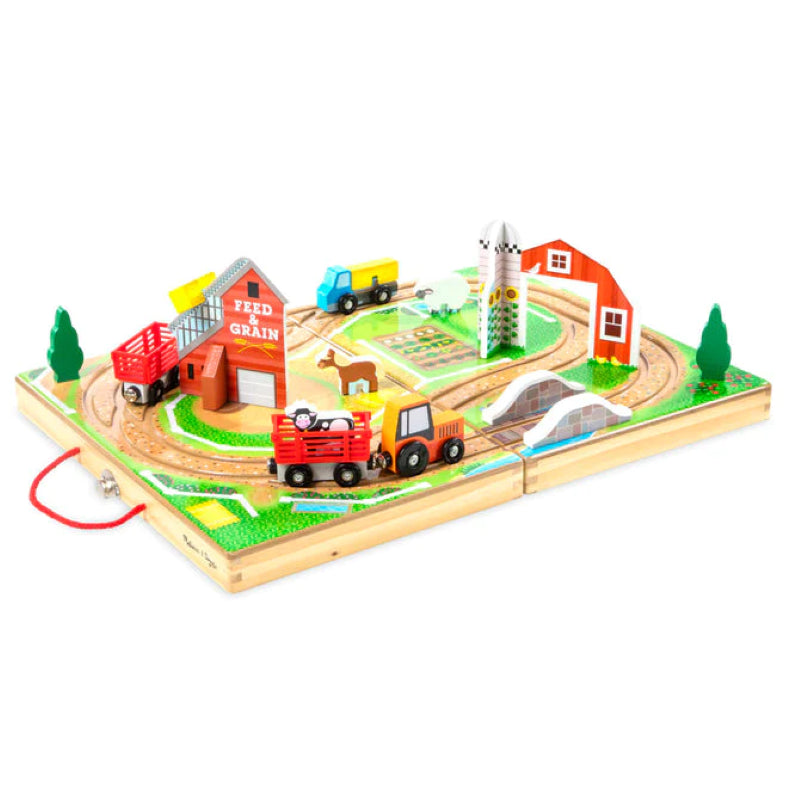 Wooden Take-Along Farm set with truck, tractor, barn, animals, and trailers, designed for imaginative play and skill development.