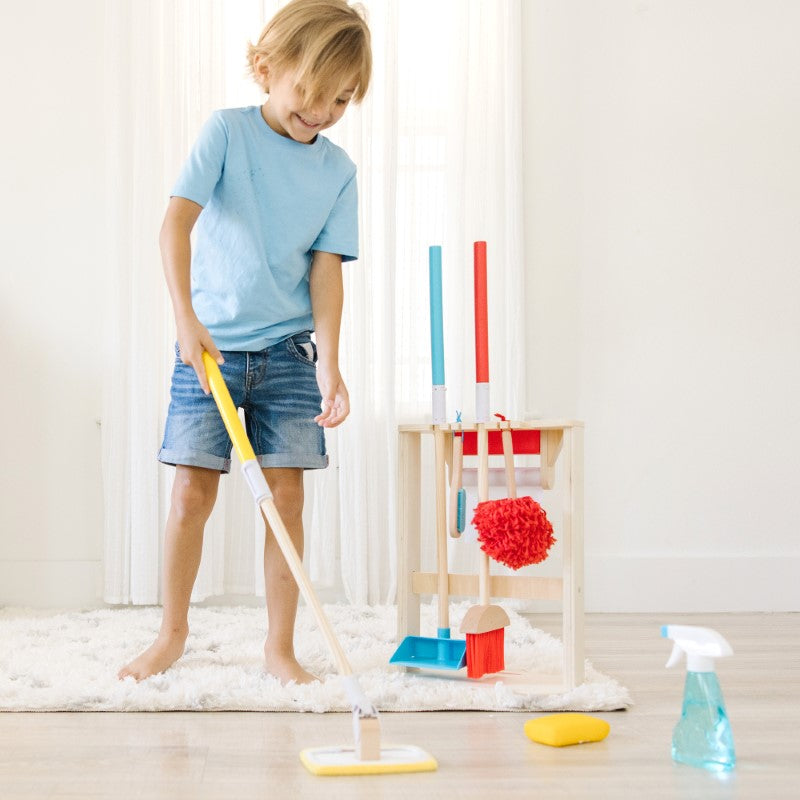 Colorful kid-sized cleaning accessories from Melissa & Doug, including a broom, mop, duster, and reusable checklist for imaginative play.