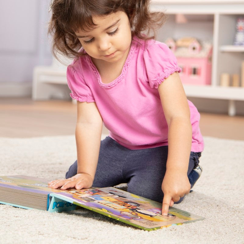 Interactive board book featuring colorful safari animals with pop-up buttons for engaging learning through play.