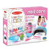 Playful nail care set for kids by Melissa & Doug featuring tools, polish bottles, and a pretend nail dryer for imaginative fun.