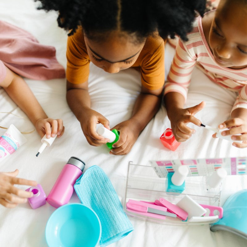 Playful nail care set with realistic tools, mess-free polish bottles, and LED dryer for imaginative manicures and pedicures.