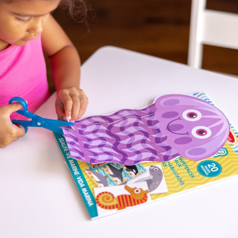 Colorful ocean-themed scissor skills activity pad by Melissa & Doug with 20 projects for kids to enhance fine motor skills.