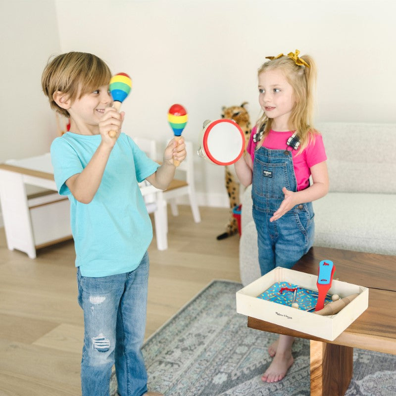 Colorful children's musical instrument set featuring tambourine, cymbals, maracas, and more for creative sound exploration.