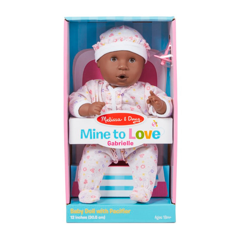 12-inch Gabrielle baby doll with dark skin, removable outfit, and thumb-sucking feature for imaginative play and nurturing.