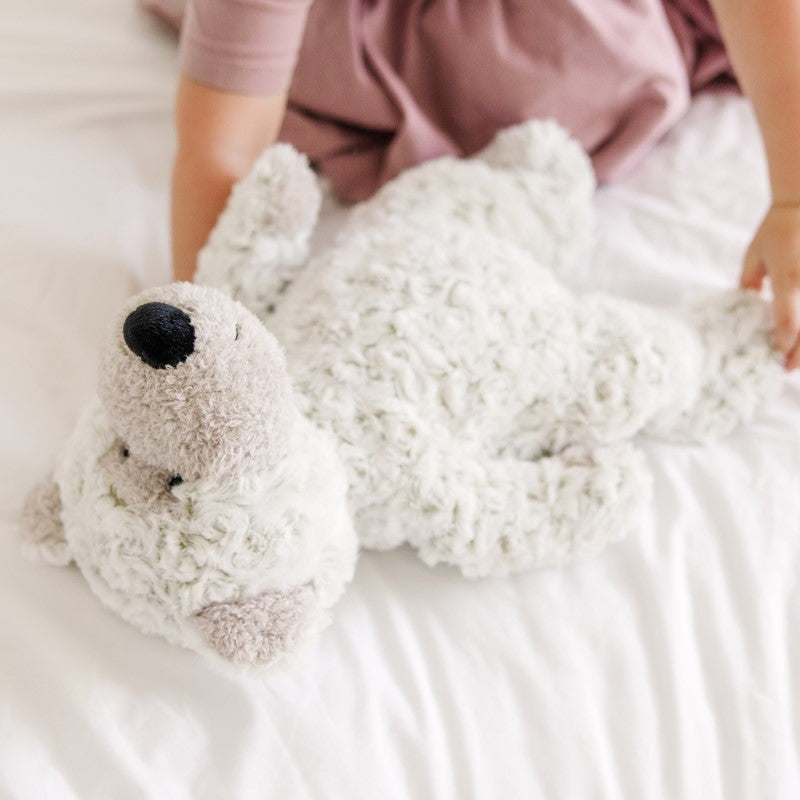 Ultra-soft Greyson Bear by Melissa & Doug, featuring a floppy design and weighted bottom, perfect for cuddles and imaginative play.