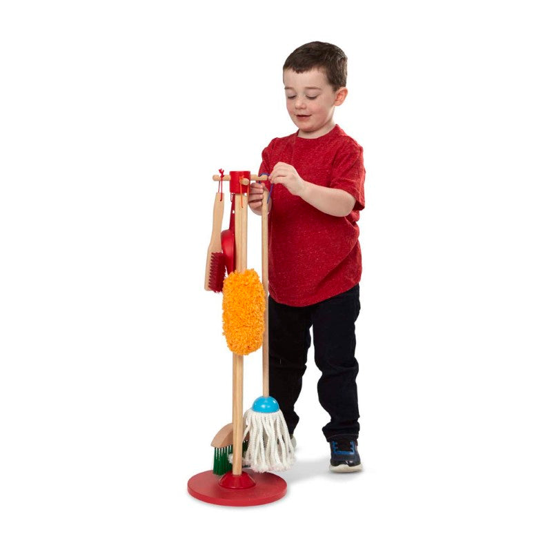 Colorful six-piece kids' cleaning set from Melissa & Doug, featuring a broom, mop, duster, and more with natural-wood handles.