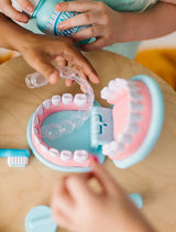 Playful dentist set with oversized teeth, realistic tools, and accessories for kids to explore dental care and hygiene.