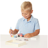 Wooden race car craft kit by Melissa & Doug, featuring paint, stickers, and easy assembly for creative kids aged 4 and up.