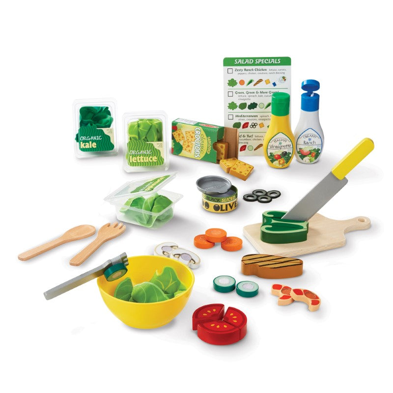 Colorful 52-piece pretend salad set with felt greens, slice-able wooden veggies, and dressing bottles for imaginative play.