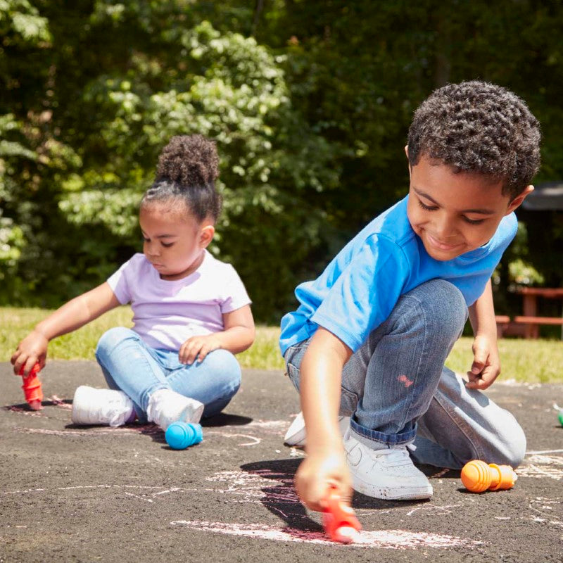 Colorful sidewalk chalk set for toddlers with adjustable holders, promoting creativity and fine motor skills while keeping hands clean.