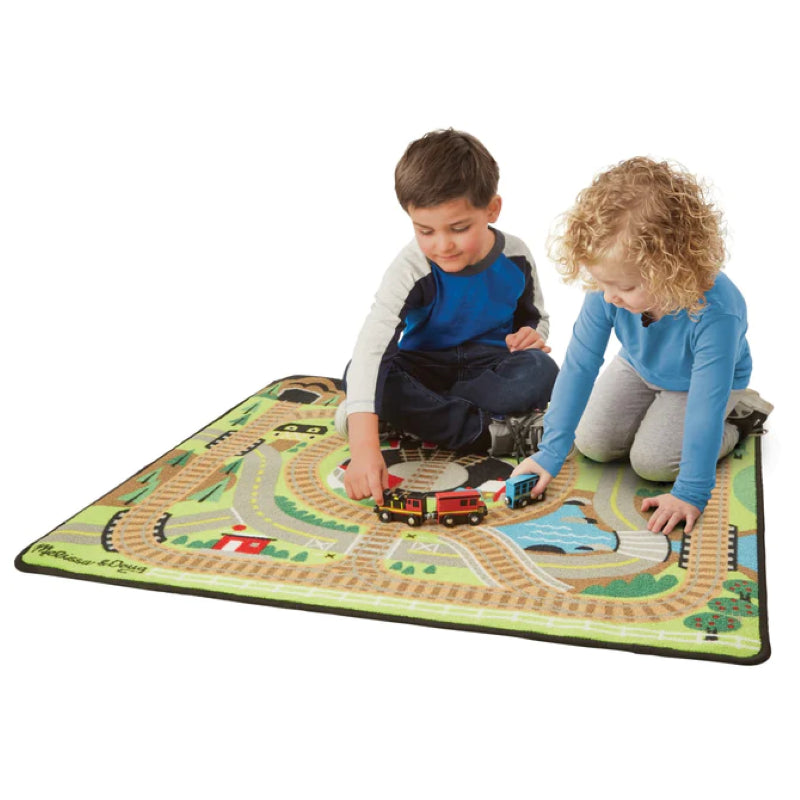 Colorful Round the Rails Train Rug featuring tracks, roads, and three wooden train cars for imaginative play and adventures.