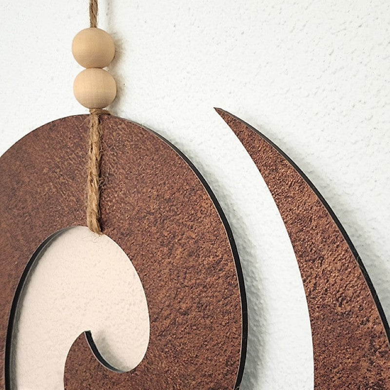 Rusted copper textured wall art featuring a Koru design, 300mm diameter, perfect for indoor or sheltered outdoor decor.