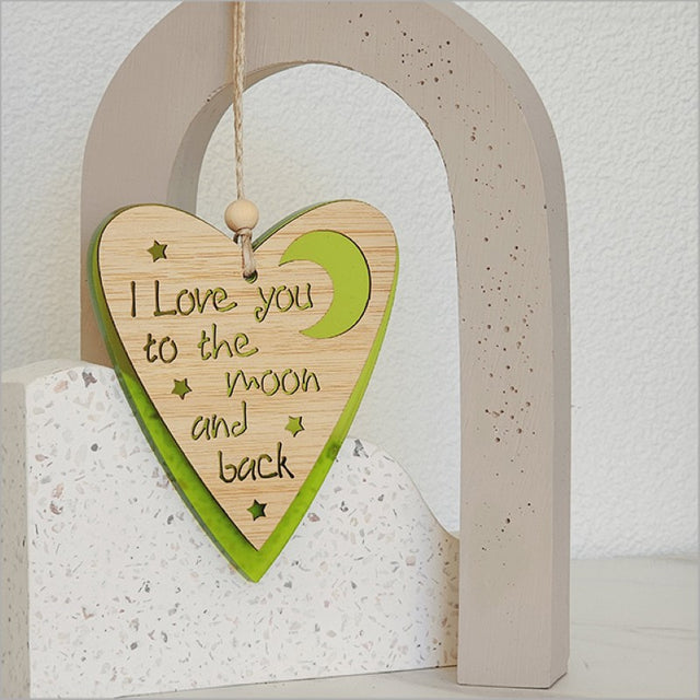 Lime satin acrylic heart-shaped hanging ornament with intricate laser-cut design, perfect for decor or thoughtful gifting.