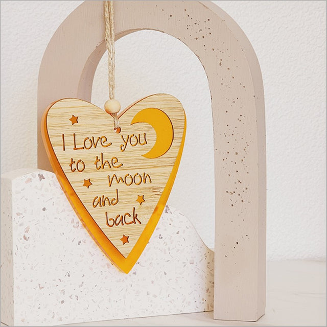 Vibrant orange heart and moon hanging ornament in satin acrylic, ideal for home decor and thoughtful gifts.