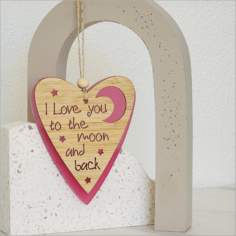 Pink satin acrylic heart and moon hanging ornament, measuring 90mm x 105mm, perfect for adding romantic charm to any space.