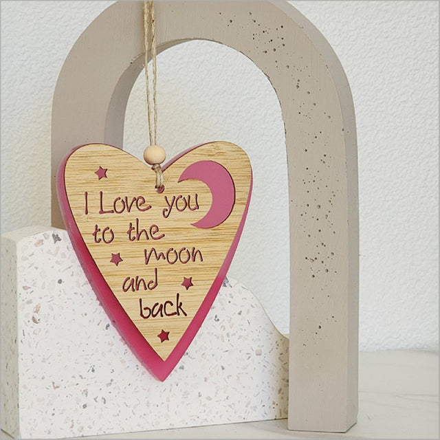 Pink satin acrylic heart and moon hanging ornament, measuring 90mm x 105mm, perfect for adding romantic charm to any space.