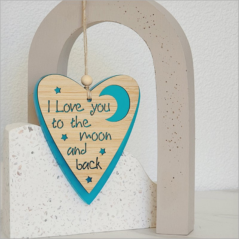 Teal satin heart ornament with moon design, made from laser-cut bamboo, perfect for hanging or gifting.