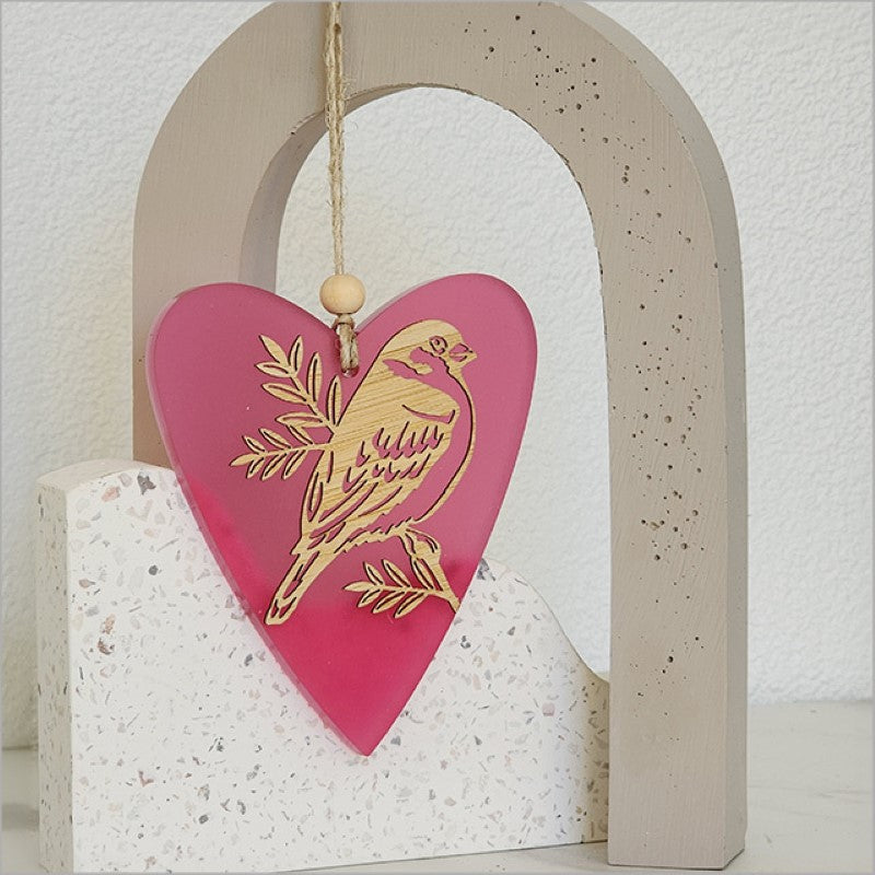 Heart-shaped pink satin acrylic ornament with intricate bird designs, perfect for home decor or gifts.