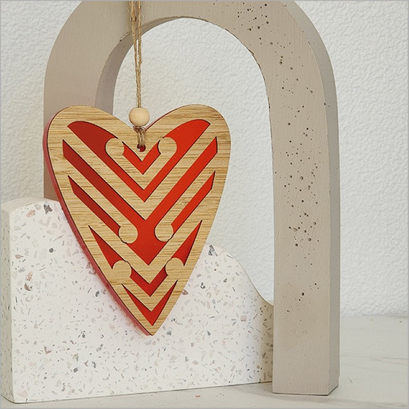Red satin acrylic heart ornament featuring intricate laser-cut designs, perfect for holiday decor or a heartfelt gift.