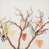 Elegant blue satin acrylic heart ornament featuring intricate Koru patterns, perfect for home decor or gifting.