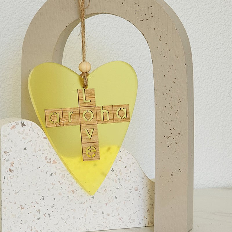 Bright yellow heart ornament with bamboo backing, double-sided design, perfect for gifting and home decor.