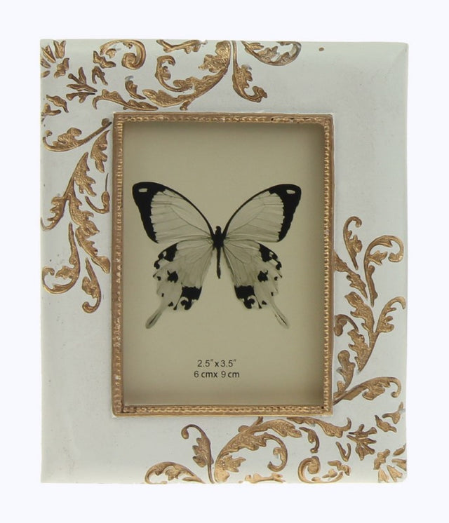 Set of 2 golden embossed fern photo frames, measuring 10x1.5x12cm, ideal for stylishly displaying cherished memories.