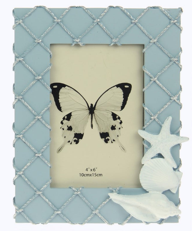 Decorative blue fishing net frame showcasing shells, perfect for coastal decor and displaying seaside memories.