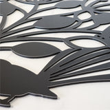 Wall art featuring a black fantail and pohutukawa design, made from durable ACM, suitable for indoor/outdoor use.