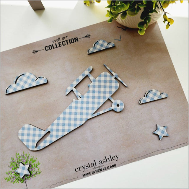 Wall art set featuring textured blue check propeller planes, perfect for adding vintage charm to any space.