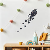 Textured MDF wall art featuring a rocket and six stars, ideal for children's nursery and bedroom decor.