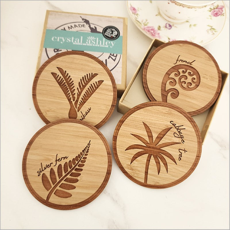 Eco-friendly bamboo and Rimu coasters showcasing NZ Native Trees, perfect for protecting surfaces and enhancing decor.