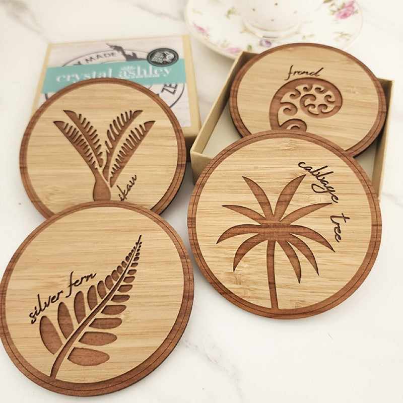 Beautiful Bamboo and Rimu coasters showcasing NZ Native Trees, eco-friendly, 100mm diameter, perfect for any drinkware.