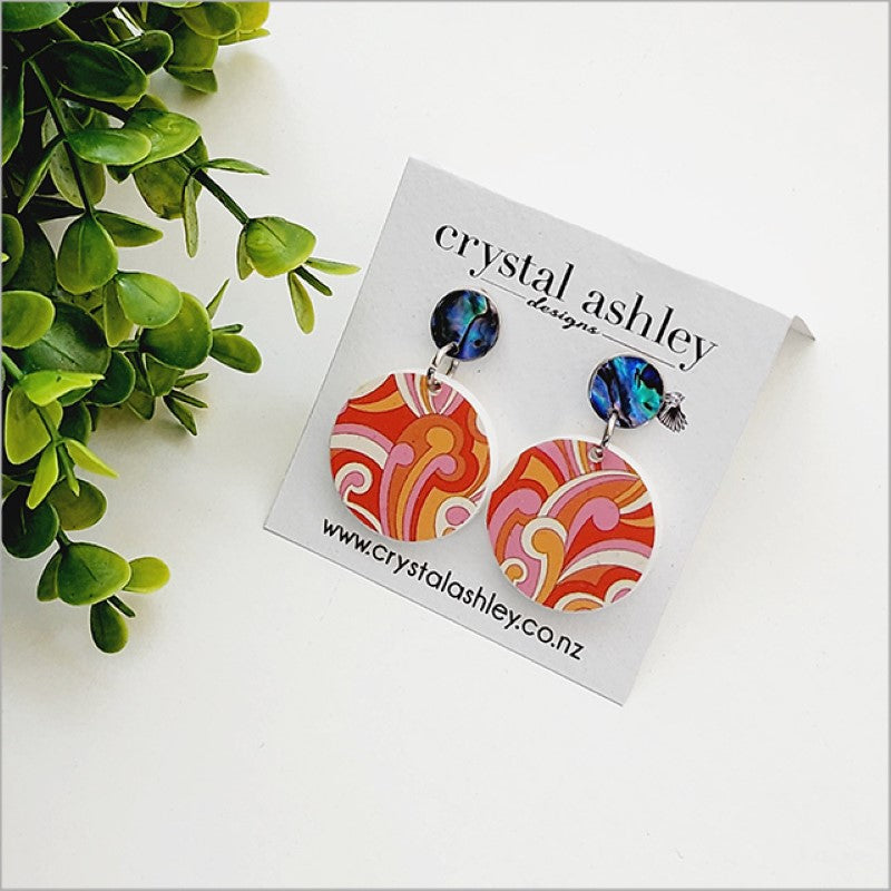 Colorful drop dangle earrings featuring round Koru design and Paua shell, inspired by New Zealand culture and style.